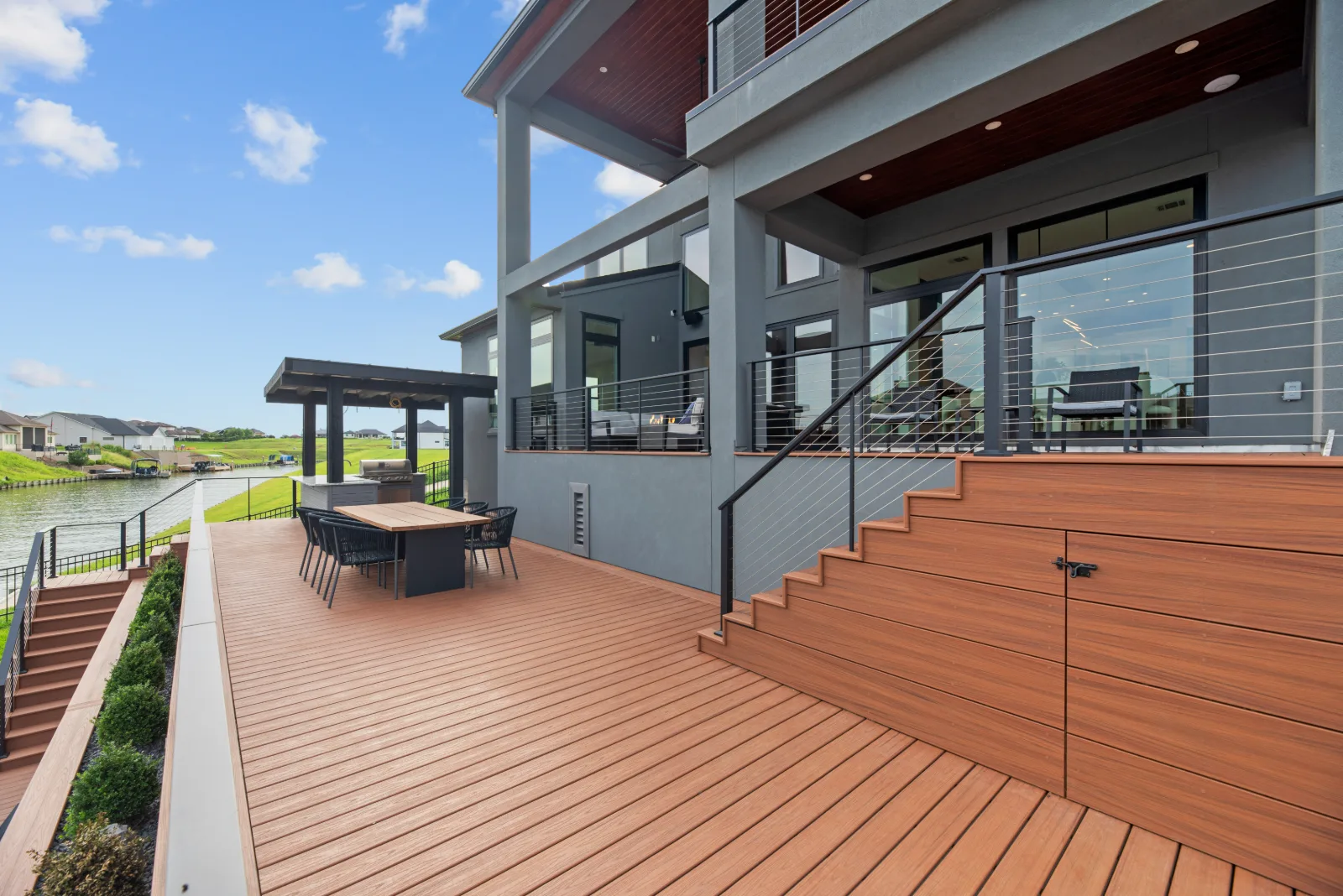 Covered patio and deck overlooking the lawn