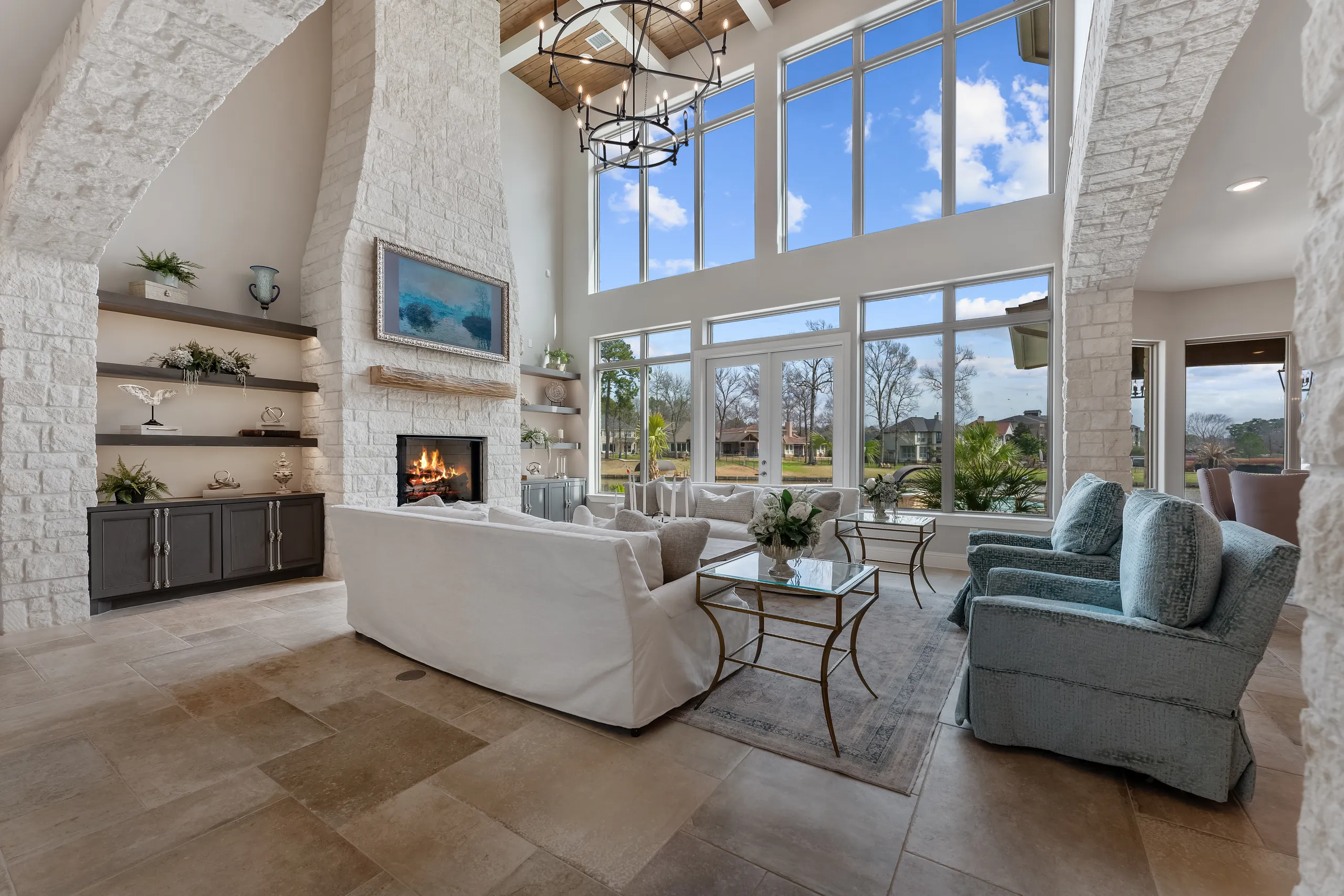 White-stone living room with steel-framed windows