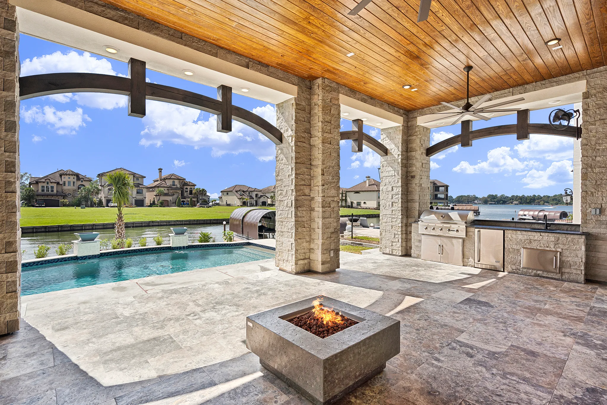 Outdoor kitchen with stone accent wall