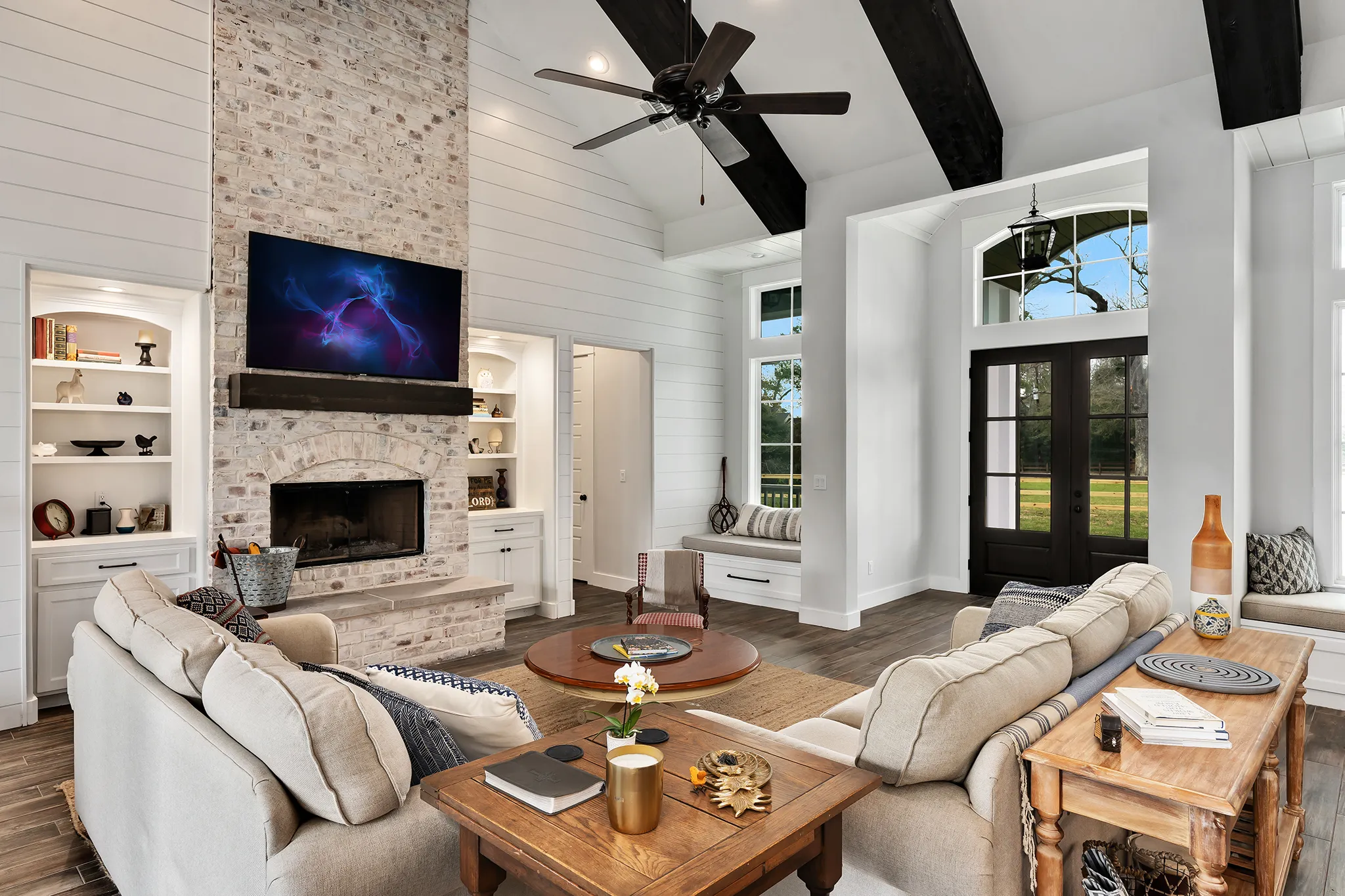 Vaulted living room with whitewashed brick