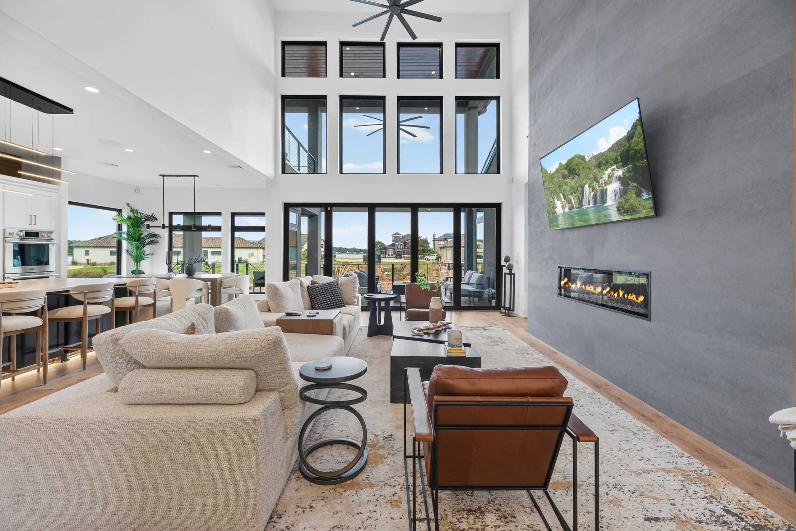 Two-story living room with linear fireplace and clerestory windows