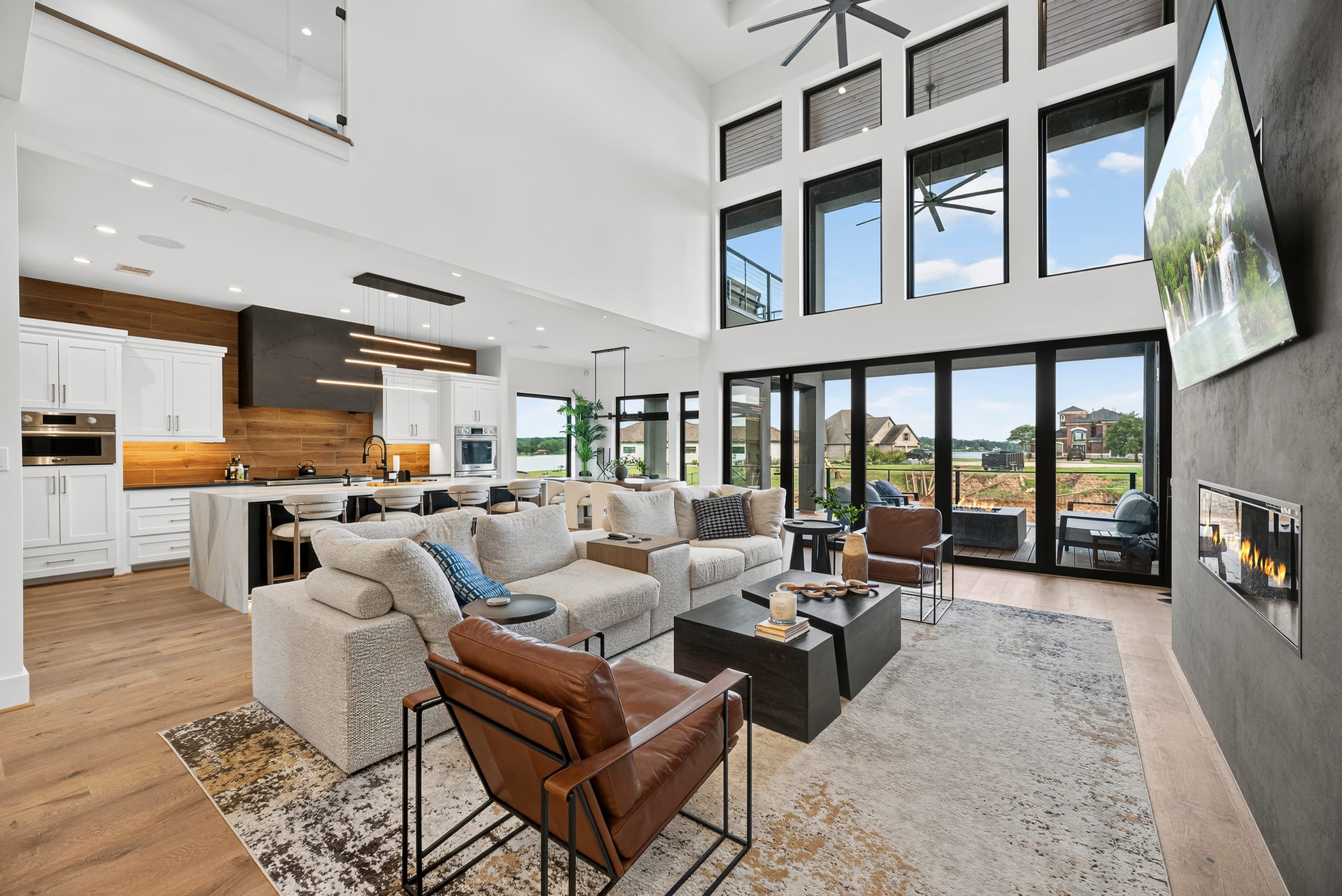 Two-story living and kitchen with lake views