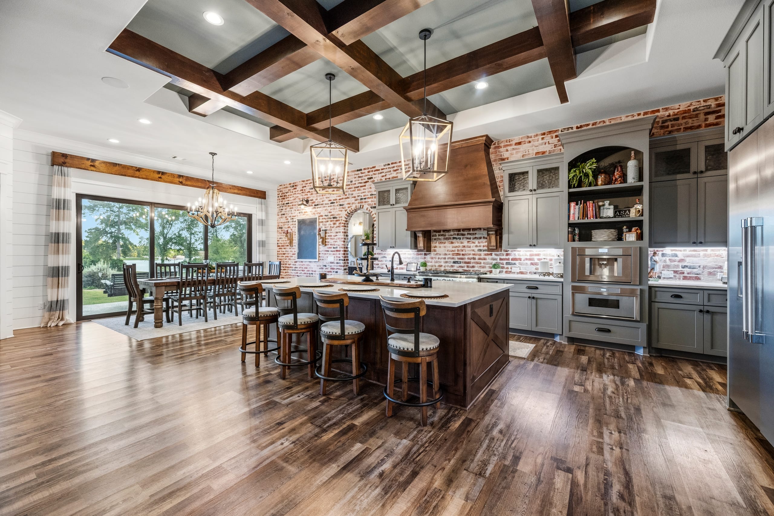 Coffered-beam kitchen with brick and copper hood