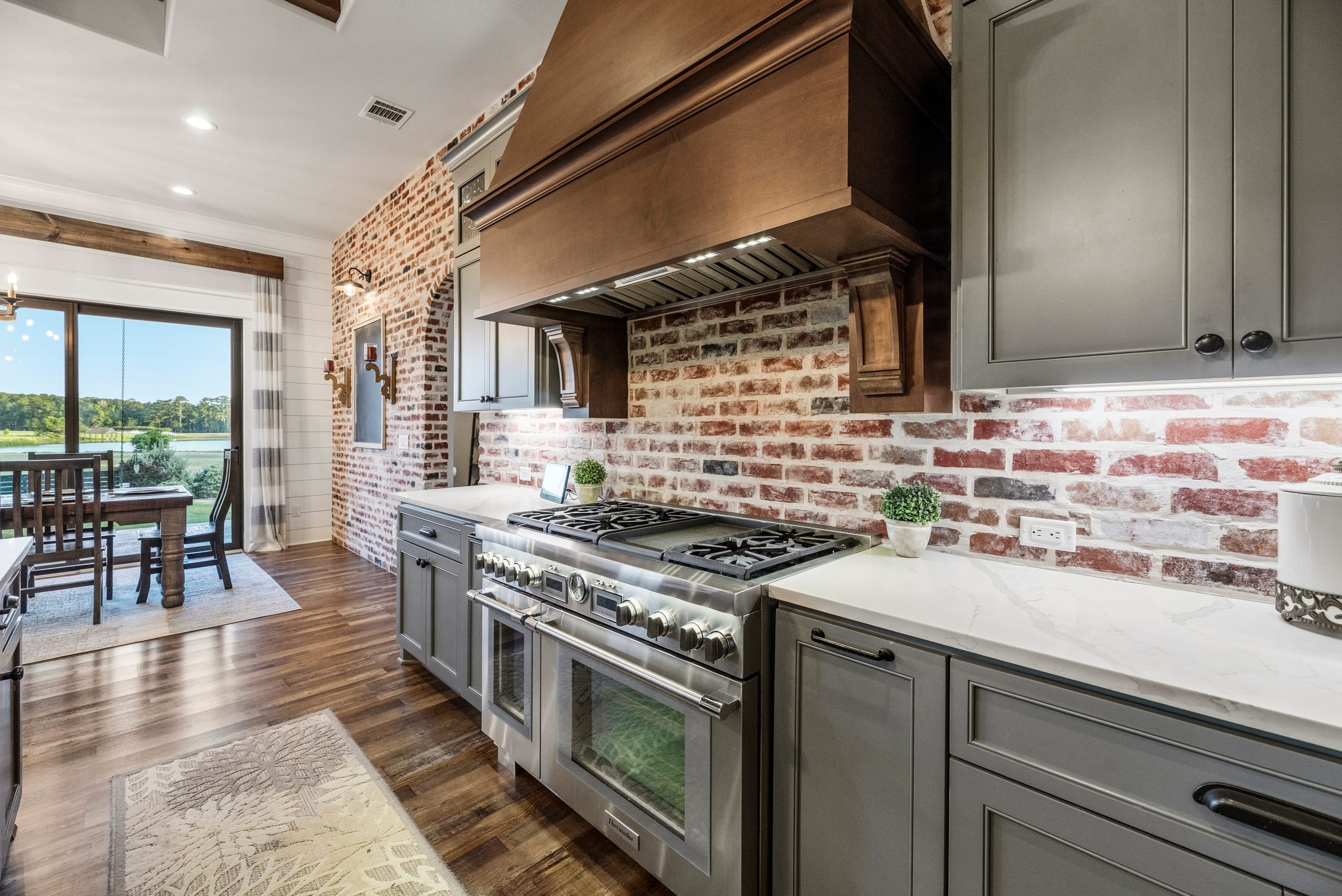 Pro range and brick backsplash with lake views