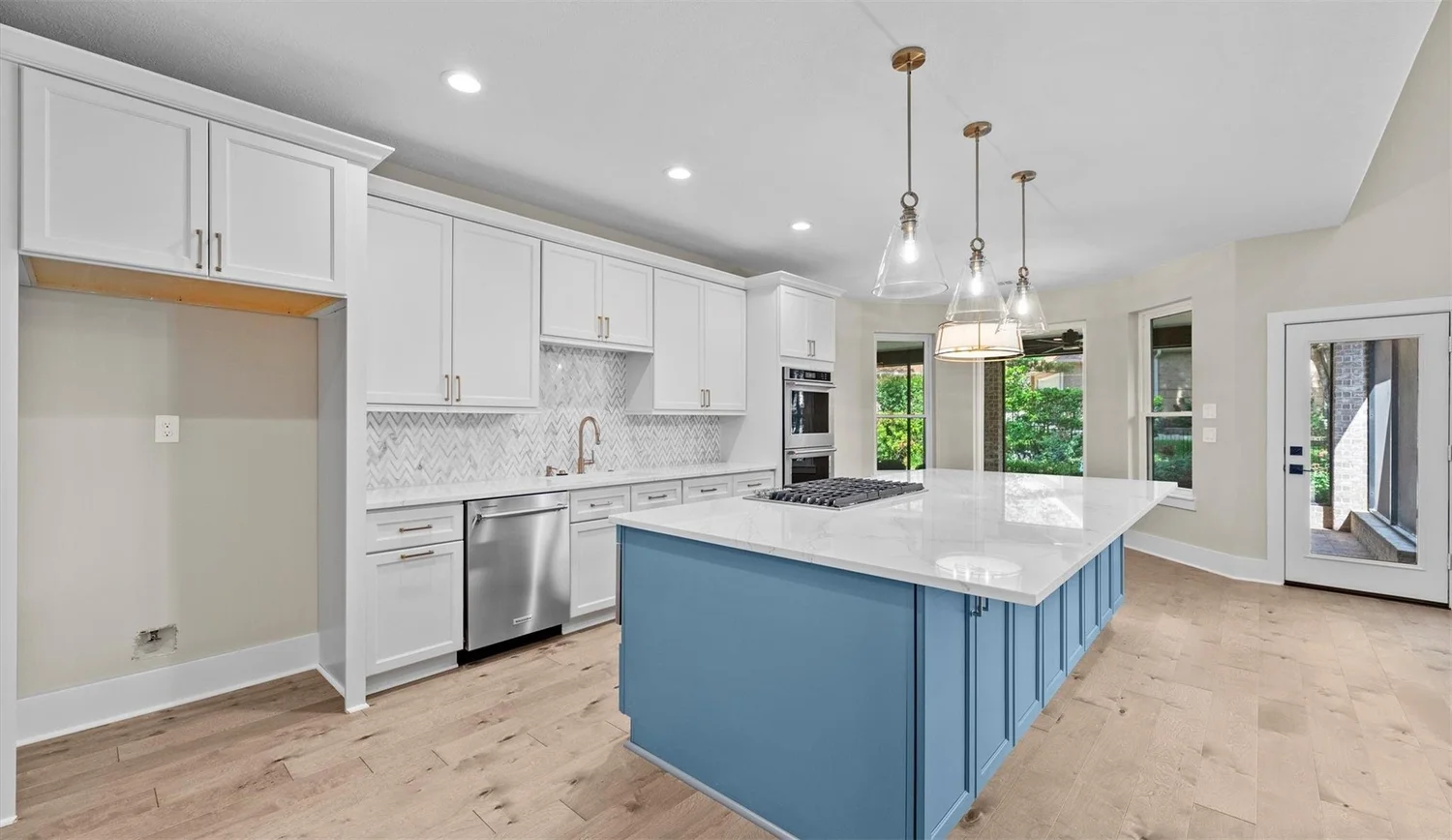 Navy cabinetry with quartz counters