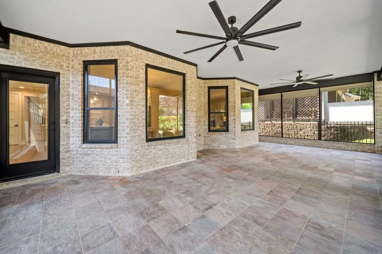 Covered patio, fire pit, and the boat dock beyond